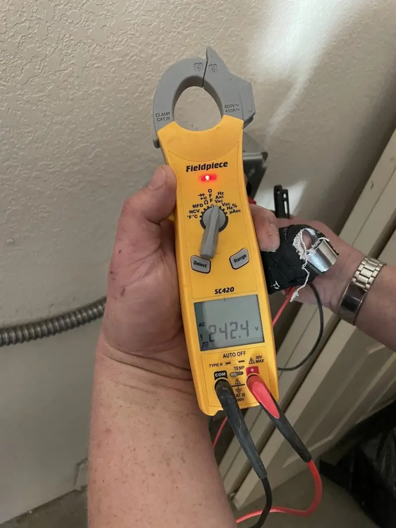 Voltage testing with clamp meter during Outlet Installation in Sangaree